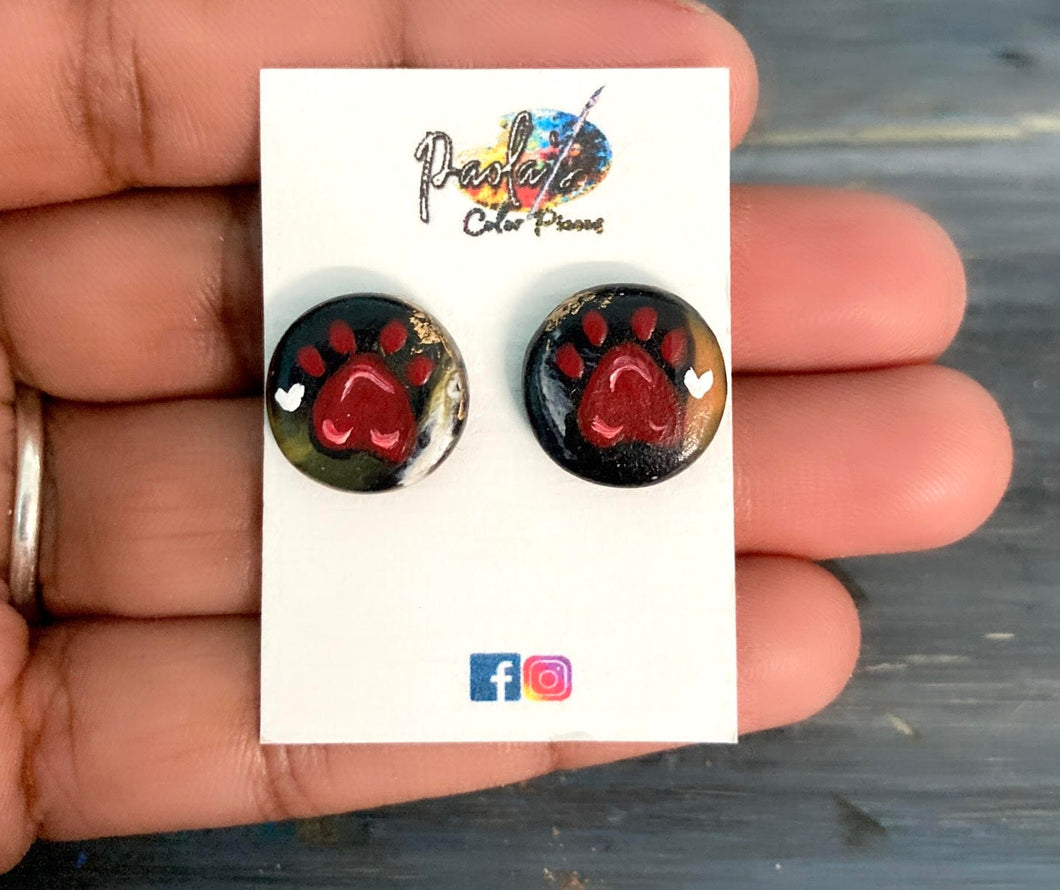 Black earring studs with cat footprint.