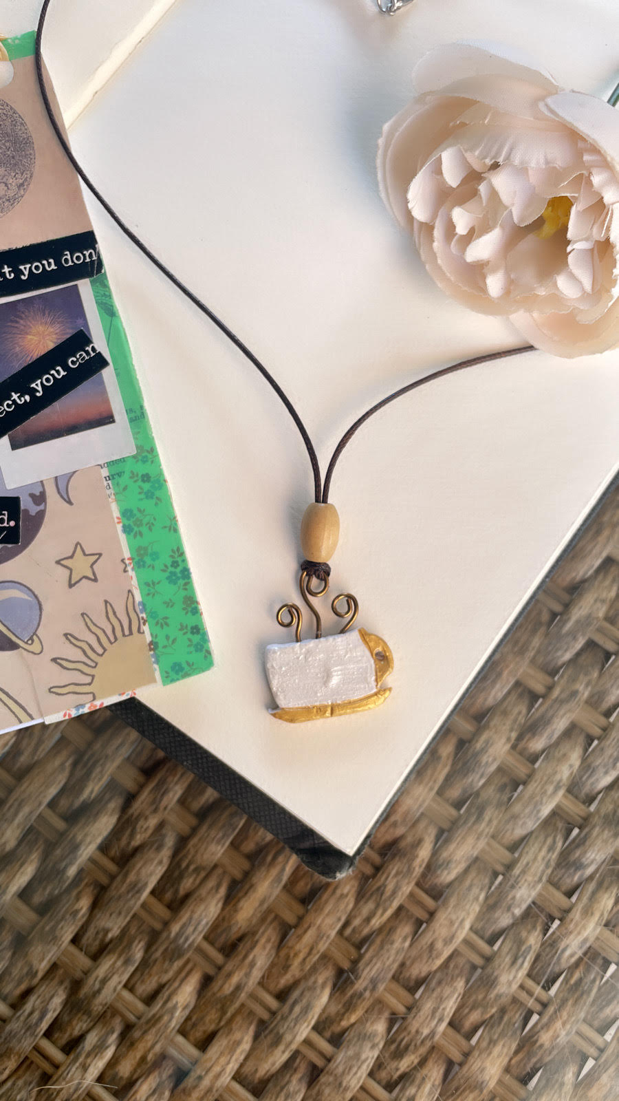 Pearl coffee cup necklace.